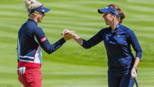 Charlie Hull and Georgia Hall celebrate a birdie on the  6th green to halve the match against England Mens team of Matt Wallace and Eddie Pepperel. — courtesy Tristan Jones