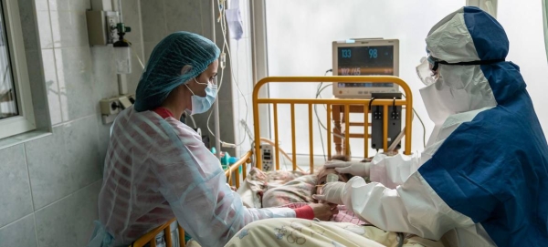 A mother and doctor tend to a young girl with COVID-19 at an intensive care ward in the western region of Chernivtsi, Ukraine. — Courtesy photo