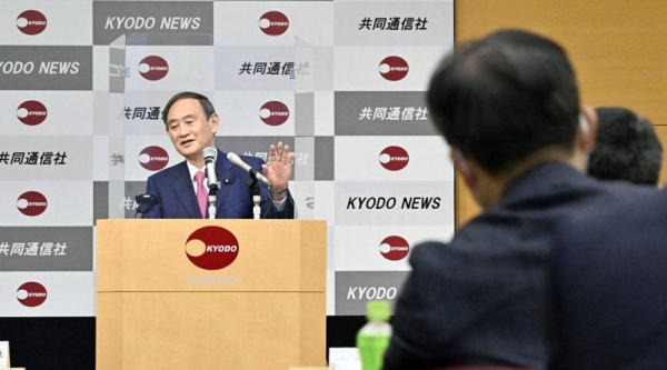 
Japanese Prime Minister Yoshihide Suga makes a speech at the Kyodo News head office in Tokyo on Friday. — courtesy Kyodo