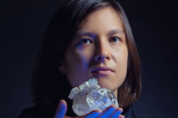 Helen Schwerdt, a postdoc in Ann Graybiel's lab, builds ultrathin probes (blue) that target brain microstructures with pinpoint accuracy. — courtesy photo: Michael D. Spencer