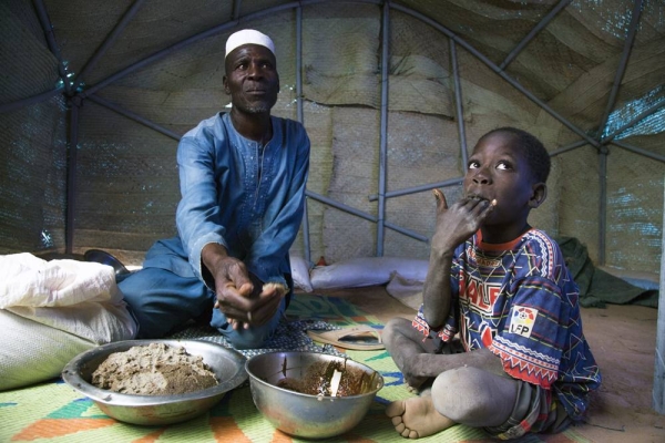 Osena Previlon’s older daughter 14-year-old Bevalie Jean-Jacques, peels eggplants brought by her mother from the field as she helps with preparing lunch in the family’s kitchen – a little mud house separated from the main house. — courtesy WFP/Alexis Masciarelli