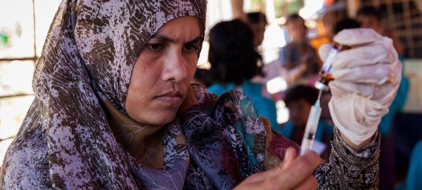 A health worker fills a syringe with a vaccine at a Rohingya refugee camp in Cox’s Bazar, Bangladesh, in this file picture. — Courtesy photo