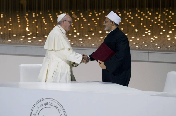 File photo, on day two of the UAE papal visit, shows Pope Francis, head of the Catholic Church (L) and Dr. Ahmad Al Tayyeb, grand imam of the Al Azhar Al Sharif (R), sign the 'Human Fraternity Document''’ during the Human Fraternity Meeting, at The Founders Memorial.

( Mohamed Al Baloushi for the Ministry of Presidential Affairs )
---