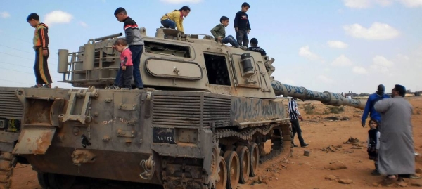 Children play on an abandoned tank in Libya in this file picture. — Courtesy photo