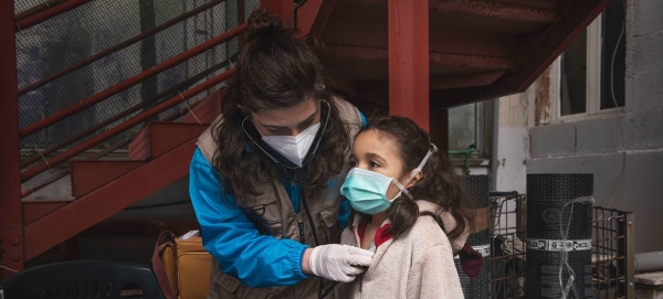 A girl receives a medical screening from Doctor Antonella Tochiaro in an informal settlement where she lives in Rome, Italy, in this file picture. — Courtesy photo