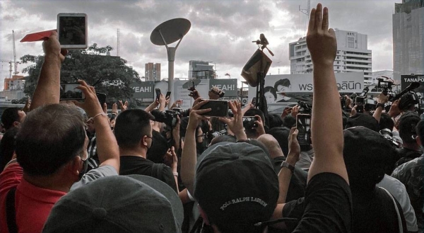 A demonstration takes place on the streets of Bangkok, Thailand. — courtesy Unsplash/Kitthitorn Chaiyuthapoo