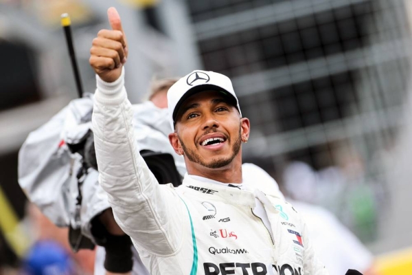 British driver Lewis Hamilton made Formula One history on Sunday, winning the Portuguese Grand Prix for a 92nd career victory to move one ahead of German great Michael Schumacher.