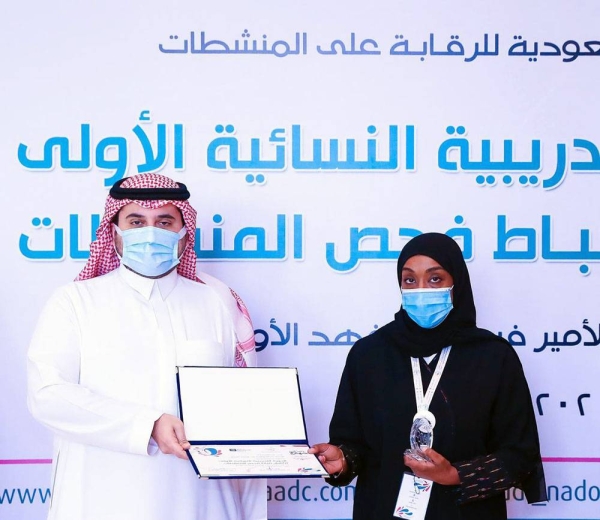One of the trainees being presented with their doping control officer (DCO) certificates.