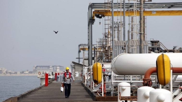 An Iranian laborer is seen walking the platform of the oil facility in Khark Island in this file photo. — AFP