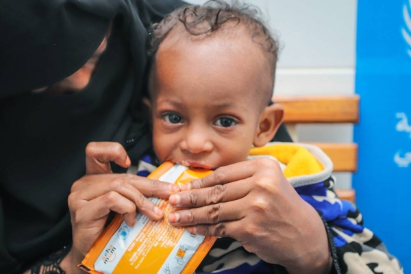 Malnutrition surges among young children in Yemen as conditions worsen. WFP provides nutrition support to children and mothers in Yemen to both treat and prevent malnutrition. — courtesy Alaa-Noman

In the photo: The midwife is conducting the necessary checks such as temperature measurement and MUAC measurement.

Left to right: 
Ashjan, (midwife), Rafiq, (7 months child) and Intisar, (mother 32) 

Photo: © WFP/Alaa Noman