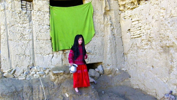 File photo shows a young girl standing outside her shelter in the in Fazal Baig district, near Kabul. — courtesy UNICEF/Asad Zaidi
