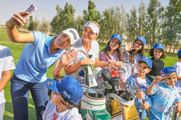 Camilla Lennarth & Amy Boulden teaching Saudi kids at a golf clinic in 2019.