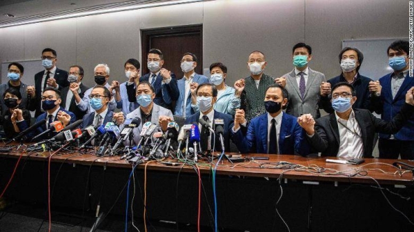 Pro-democracy lawmakers join hands at the start of a press conference in a Legislative Council office in Hong Kong on Wednesday. — Courtesy photo
