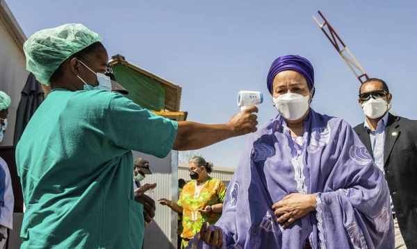 UN Deputy Secretary-General Amina Mohammed has her temperature taken to screen for COVID-19 symptoms on the UN compound in Bamako, Mali. — courtesy MINUSMA/Harandane Dicko
