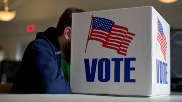 An American casts his vote in the Nov. 3 presidential elections, which has been called 