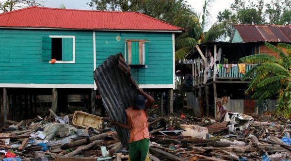 A resident of Puerto Cabezas (Bilwi), the main town on Nicaragua's Northern Caribbean region, clears the debris on his home after the passage of Hurricane Eta. — courtesy WFP/Photolibrary