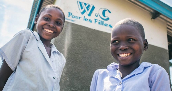 

Student-members of the Health Brigade outside the latrines of Dikolelayi Primary School in Kananga, Kasai-Occidental province, Democratic Republic of Congo (DRC). — Courtesy UNICEF/V. Tremeau