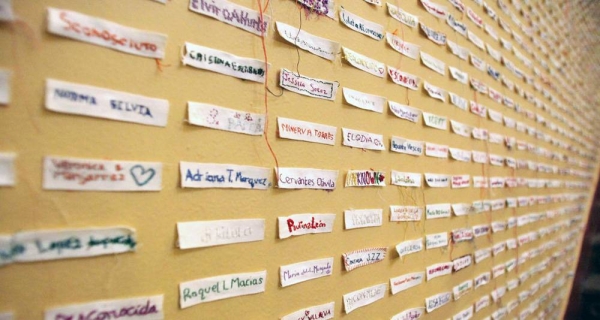 
Labels with the names of victims of femicide, as well as the 'unknown' represent the victims of femicide at an exhibition in Mexico. — courtesy UN Women/Alfredo Guerrero