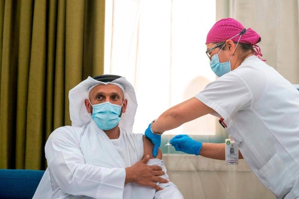 heikh Abdullah bin Mohammed Al Hamed, chairman of the Department of Health Abu Dhabi, receives a vaccine during a clinical trial for the third phase of the inactive vaccine for Covid-19. — Courtesy WAM 