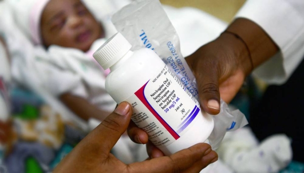 An HIV-positive woman receives medication for her three-day-old baby at a hospital in Ouagadougou, Burkina Faso. Critical HIV services in many countries have been disrupted due to the coronavirus pandemic. — courtesy UNICEF/Frank Dejongh