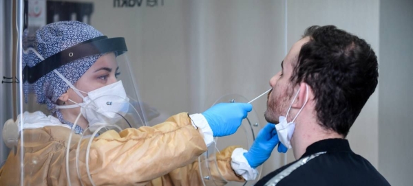 A healthcare worker at a testing facility collects samples for the coronavirus at Mimar Sinan State Hospital, Buyukcekmece district in Istanbul, Turkey, in this file picture. — Courtesy photo
