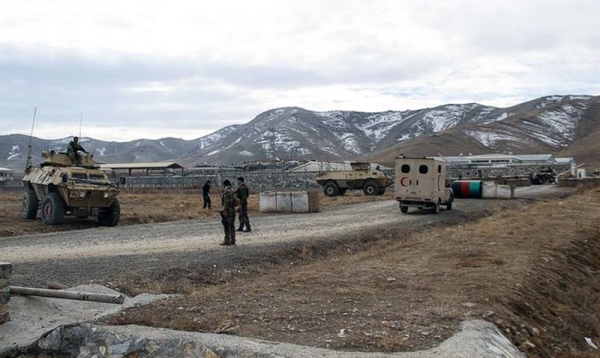 An ambulance is seen parked at the scene of the terror attack at an Afghan army base in Ghazni province in eastern Afghanistan.