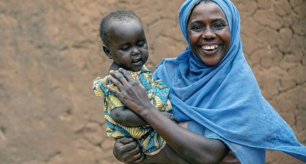 A HIV-positive woman and her baby take their medication on a daily basis at their home in Mbarara, western Uganda. — courtesy UNICEF/Karin Schermbrucker