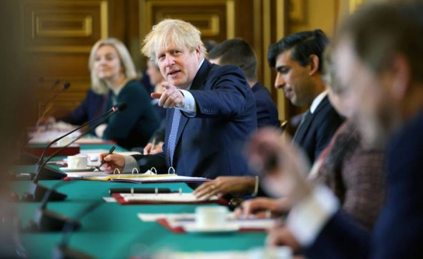 Boris Johnson, seen chairing a Cabinet meeting, faces a rebellion among UK MPs from his Conservative Party over planned new restrictions in England to combat the coronavirus pandemic.
