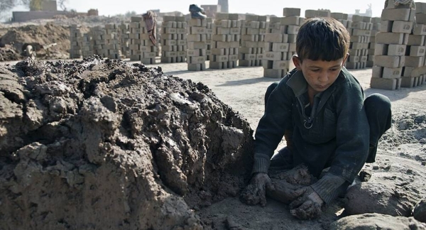 A seven-year-old child working at a brick kiln in Nangarhar province, Afghanistan. His family indebted to the kiln's owner. — courtesy UNICEF/Noorani