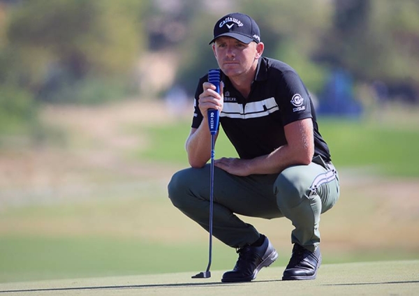 Andy Sullivan of England plays his tee shot on the ninth hole during Day One of the Golf in Dubai Championship at Jumeirah Golf Estates on Wednesday in Dubai, United Arab Emirates. — courtesy photo by Ross Kinnaird/Getty Images)