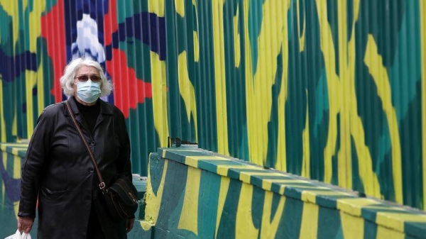 A woman wearing a mask against the spread of the coronavirus walks in Belgrade, Serbia, in this Nov. 10, 2020 file picture. — Courtesy photo