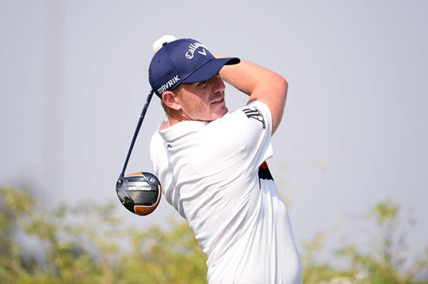 Andy Sullivan of England interacts with his caddie Thomas Riley  on the 18th hole during Day Three of the Golf in Dubai Championship at Jumeirah Golf Estates on Friday in Dubai, United Arab Emirates. (Photo by Andrew Redington/Getty Images)