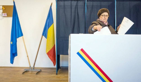 A voter casts her vote in the Sunday Romanian elections.