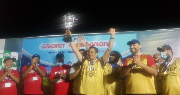 Captain of Team Sultan receives the winning trophy