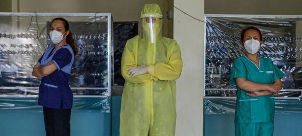 Wearing a full protective suit, a women doctor who leads a group of volunteer medical professionals attending to COVID-19 patients and persons under investigation at a community hospital in the Philippines. — Coutesy photo