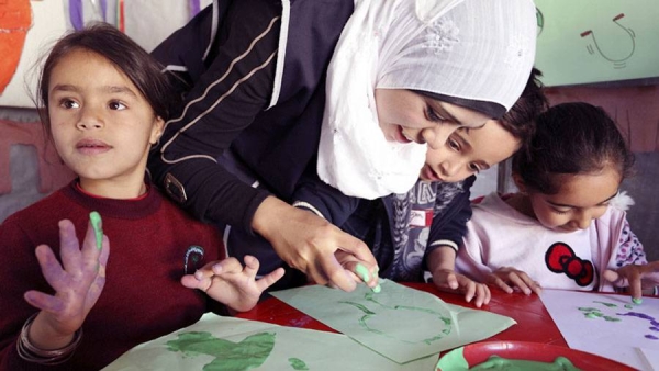 Handicrafts class for Syrian refugee children at a recreational center in Zouq Bhannine Informal Tented Settlement, Lebanon.