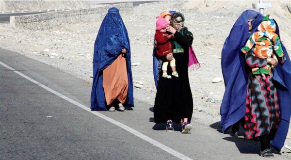 Afghan women walk to Kishm in rural Badakshan. — courtesy UNAMA/Torpekai Amarkhel