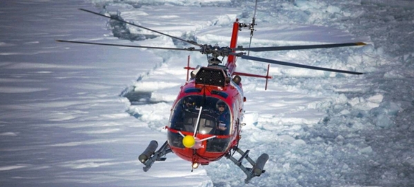 Amidst record-high temperatures, a helicopter flying over the arctic observes a planet that is changing at an unprecedented pace. — Courtesy photo