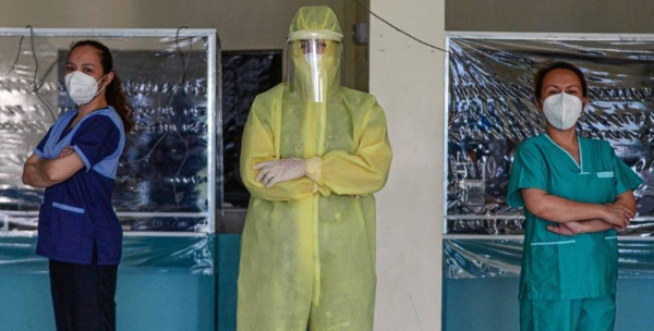 

Wearing a full protective suit, a woman doctor who leads a group of volunteer medical professionals attending to COVID-19 patients and persons under investigation at a community hospital in the Philippines. — courtesy UN Women/Louie Pacardo