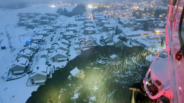 Photographs taken by a rescue helicopter confirmed a big crater above destroyed buildings.