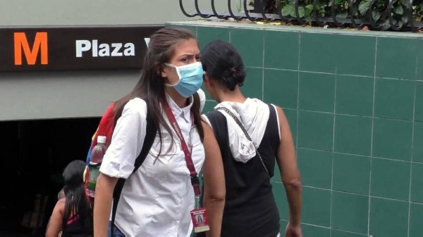 Venezuela will implement a week of hard lockdown starting from Monday to slow down the spread of the new coronavirus. File photo shows Venezuelans wearing masks.