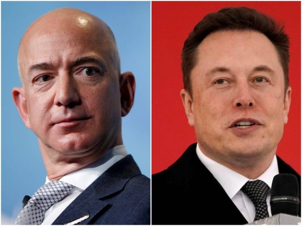 Elon Musk, right, edged past Amazon founder Jeff Bezos to grab the title of world's richest person, according to Bloomberg. — Courtesy photo
