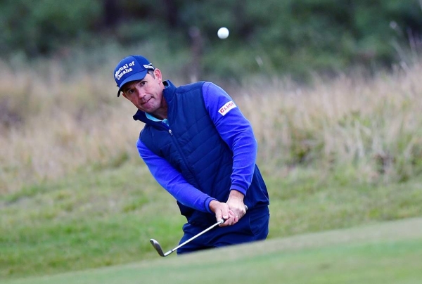 Padraig Harrington of Ireland plays his third shot on the 18th hole during the first round of the Scottish Championship presented by AXA at Fairmont St Andrews on Oct. 15, 2020 in St Andrews, Scotland. — courtesy  Mark Runnacles/Getty Images