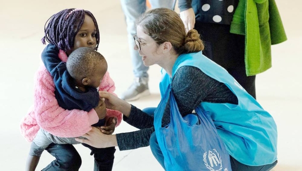 
File photo shows a UNHCR staffer welcoming resettled refugees originally from Syria and South Sudan at Lisbon airport in Portugal. — courtesy UNHCR/José Ventura