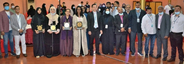 Winners of the GGI TALENT LAB news report writing competition pose for a photo with guests and organizers of the event.
