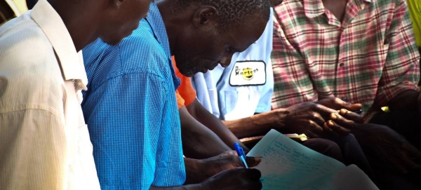This file picture shows a community group meeting in Uganda. — Courtesy photo
