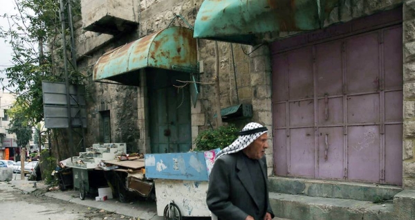 A Palestinian man in a street in Hebron, the West Bank. — courtesy UNRWA/Marwan Baghdadi