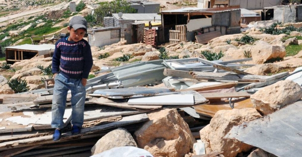 


File photo shows a little boy stands on the remains of his family's demolished home in the West Bank. — courtesy UNRWA/Lara Jonasdottir