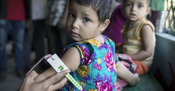 A child is tested for malnutrition at a UNICEF-supported health clinic in Bangladesh. According a UN report, malnutrition among young children and infants remains a pervasive problem in South Asia. — courtesy UNICEF/Siegfried Modola