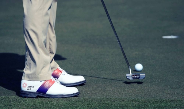 Detailed view of the shoes of Justin Thomas of the United States of America featuring a campaign for 'World NTD day' as he putts during Day One of the Abu Dhabi HSBC Championship at Abu Dhabi Golf Club on Thursday in Abu Dhabi, United Arab Emirates. (Photo by Andrew Redington)